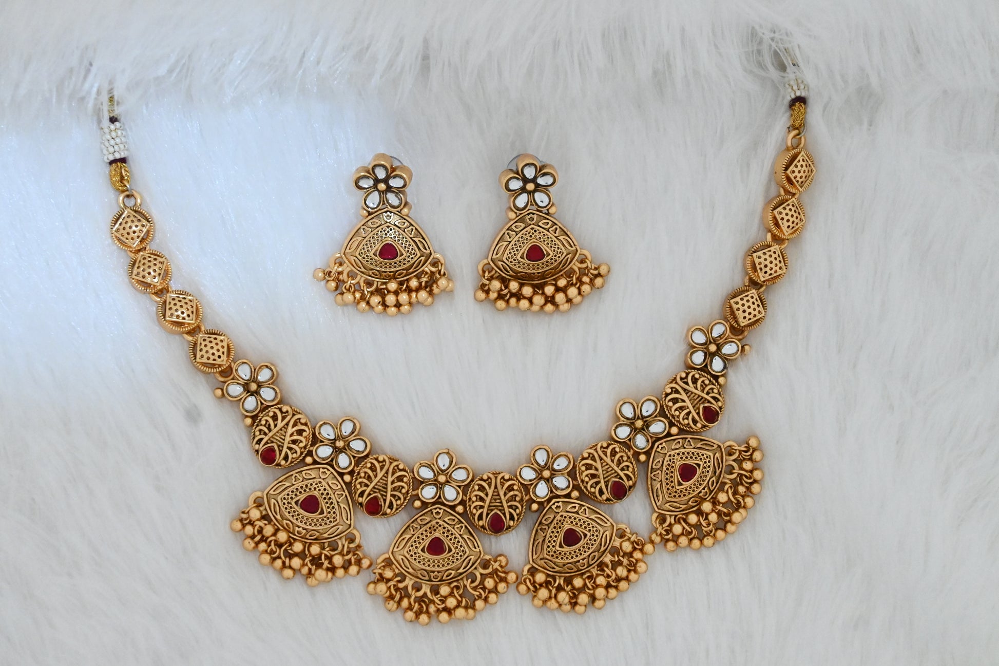 Antique gold necklace set, temple jewelry set, traditional necklace with earrings, bridal jewelry, ethnic necklace set, festive jewelry, South Indian style jewelry, gold-plated necklace, jhumka earrings, wedding jewelry set.