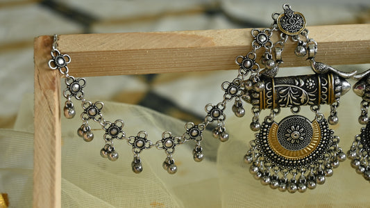 Oxidised dual tone chandelier earrings with ear chain